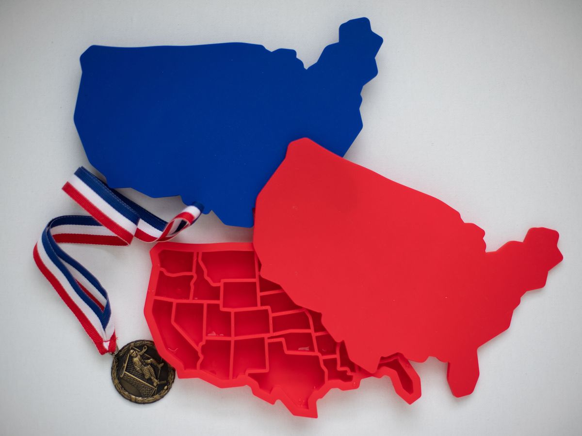 Red and blue trays with a gold medal on a red, white and blue ribbon